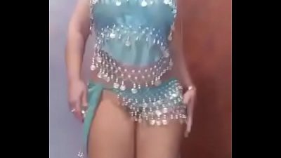 MIki does a strip tease while belly dancing then licks shit and drinks piss